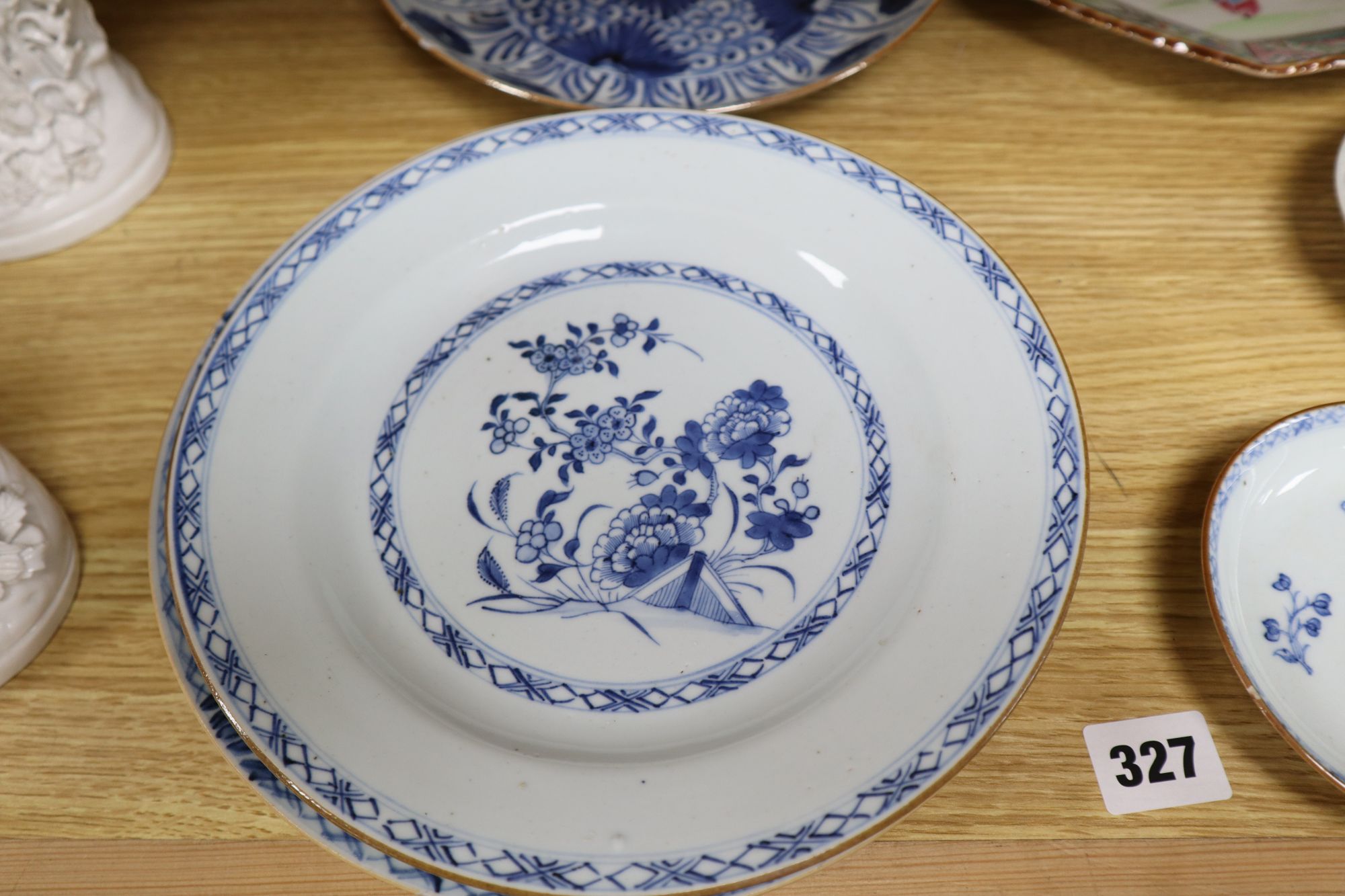 A collection of mostly 18th century Chinese export plates and dishes, a Chinese famille rose dish and another similar smaller dish